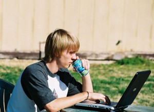 student working on his laptop